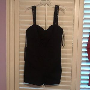 Never worn black romper with sequenced straps